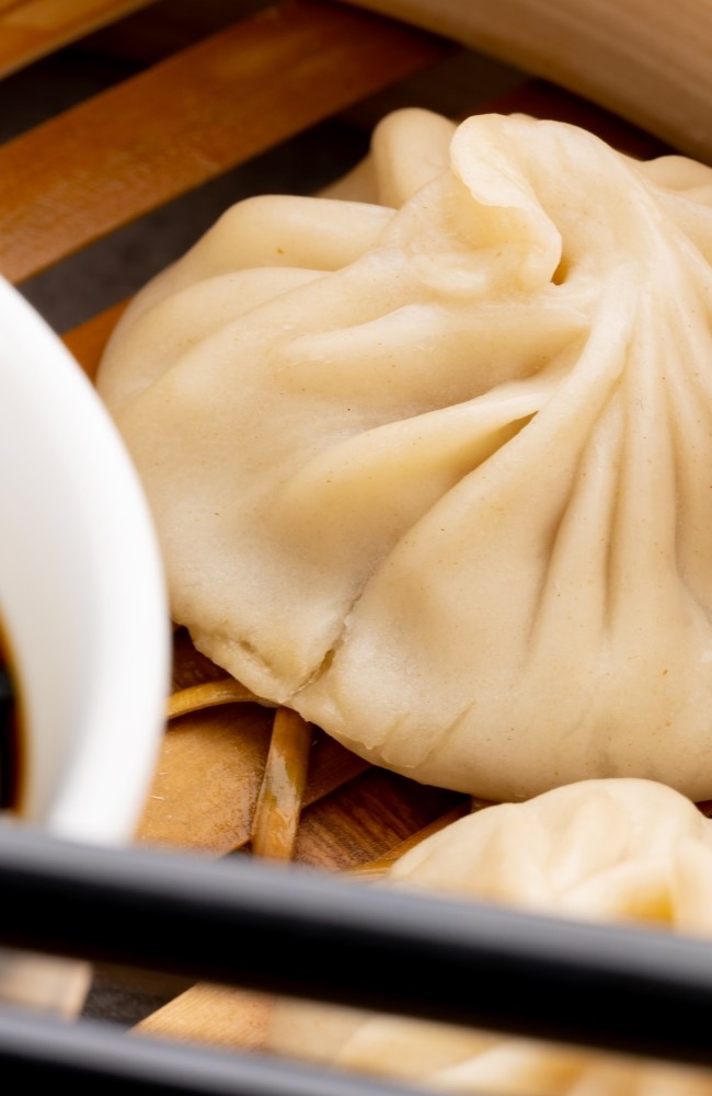 close-up-of-asian-steamed-dumplings-soy-sauce-and-2023-11-27-04-52-29-utc